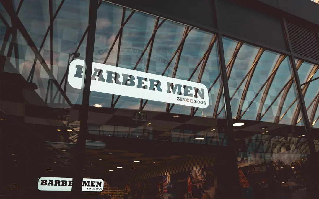 Enseigne extérieure du salon BARBER MEN à Lille, visible depuis la galerie du centre commercial Lillenium.